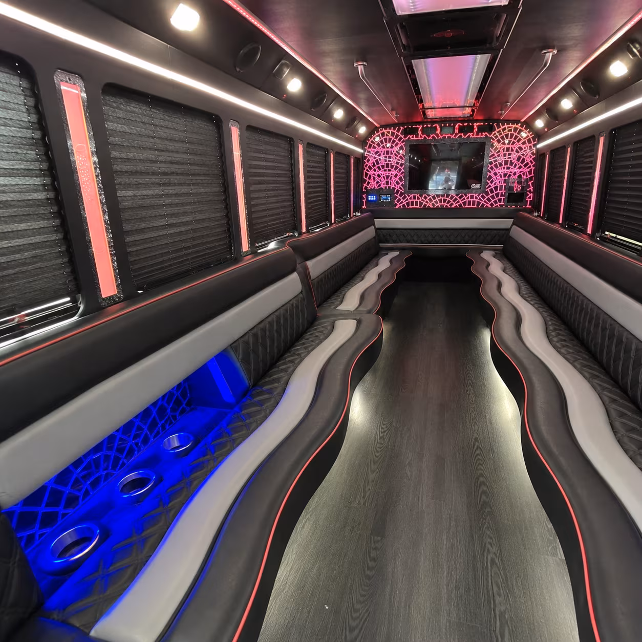 Friends laughing during a party bus celebration in Fort Collins
