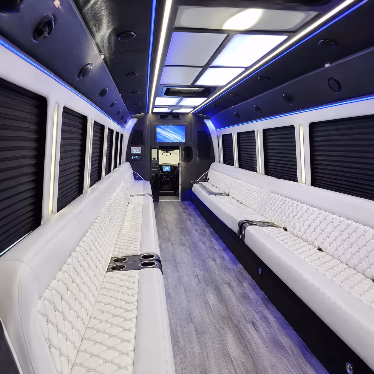 Wedding guests seated inside a party bus serving Fort Collins